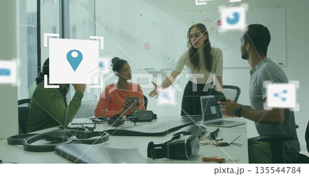 Gesturing designer presenting prototype in design studio, with drone frame and VR headset Gesturing designer presenting prototype in design studio, with drone frame and VR headset 135544784