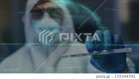 Holding blue-gloved hand gripping specimen tube in lab, streaming holographic waveforms and data Holding blue-gloved hand gripping specimen tube in lab, streaming holographic waveforms and data 135544791