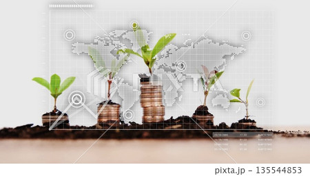 Five green seedlings sprouting from soil atop coin stacks on grid overlay with world map silhouette 135544853