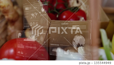Floating interface panels showing charts over wooden crates at farm stall, with tomatoes and garlic 135544949