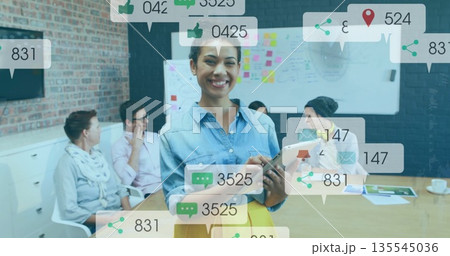 Leading discussion woman wearing blouse and skirt holding tablet in meeting room, with whiteboard Leading discussion woman wearing blouse and skirt holding tablet in meeting room, with whiteboard 135545036