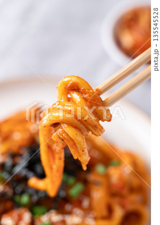 Stir fried Udon noodle with kimchi cabbage, pork, spring onion, sesame seed and seaweed Stir fried Udon noodle with kimchi cabbage, pork, spring onion, sesame seed and seaweed 135545528