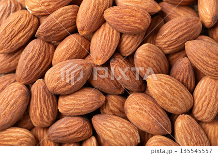 Raw almond nuts texture, Food background, Top view 135545557