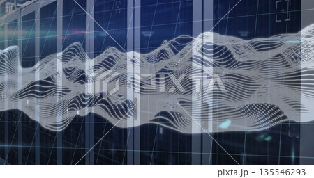 Flowing digital waveform moving across data center, with translucent grid and blue lit server racks 135546293