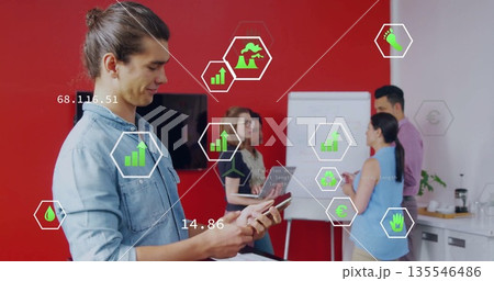 Using handheld device man in denim shirt brainstorming at meeting room with flipchart, copy space 135546486