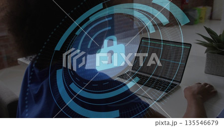 Typing code on laptop female programmer at desk, with digital padlock overlay and succulent plant 135546679