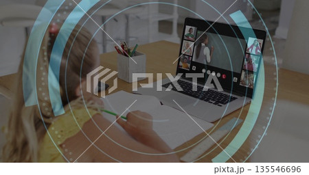 Writing girl attending class in kitchen with laptop, workbook, phone and colored pencils copy space Writing girl attending class in kitchen with laptop, workbook, phone and colored pencils copy space 135546696