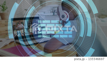 Joining African American teen streaming online class at home desk with laptop headphones overlay Joining African American teen streaming online class at home desk with laptop headphones overlay 135546697