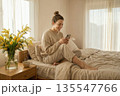 Serene Morning Routine with Fresh Flowers and Coffee in a Bright Bedroom 135547766