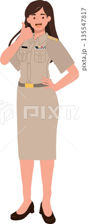 Asian female civil servant in Thai government uniform showing positive gesture in a professional environment. 135547817