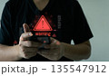 Cybersecurity Warning Alert on Smartphone with Red Hazard Symbol 135547912