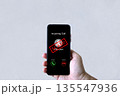 Smartphone screen shows unknown scam call, highlighting phone fraud risks, cyber threats 135547936