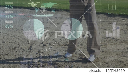 Standing male wearing grey jacket brown pants on sandy edge, with semi-transparent data overlays 135548639