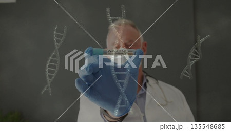 Gloved senior male doctor holding COVID-19 VACCINE vial in lab, with DNA graphics and stethoscope 135548685