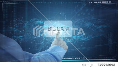 Extending right forearm in light blue shirt at virtual data environment, touching BIG DATA panel 135548698