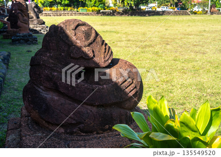 Stone tiki statue in Atuona, Hiva Oa, Marquesas Islands, French Polynesia Stone tiki statue in Atuona, Hiva Oa, Marquesas Islands, French Polynesia 135549520
