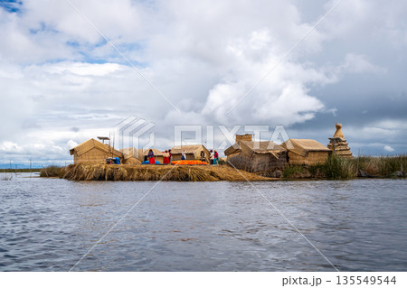 Floating island "Uros Titino" on Lake Titicaca in Peru Floating island "Uros Titino" on Lake Titicaca in Peru 135549544