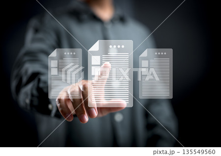 Person Interacting with Digital Document Icons on Transparent Interface Person Interacting with Digital Document Icons on Transparent Interface 135549560