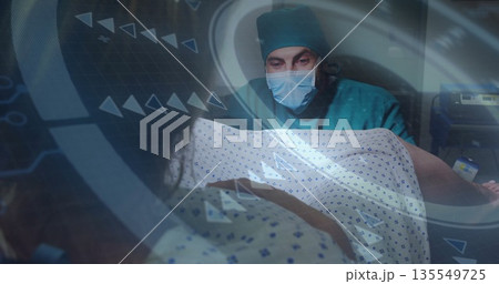 Monitoring patient vitals surgeon in teal scrubs using digital overlay at hospital room, copy space Monitoring patient vitals surgeon in teal scrubs using digital overlay at hospital room, copy space 135549725