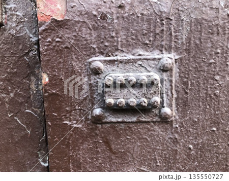 combination lock on an old door 135550727