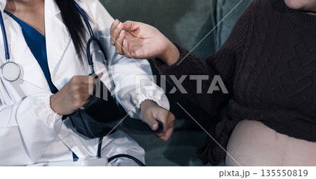 cropped shot of doctor examining pregnant woman during medical consultation 135550819
