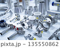 Stainless steel pipe fittings, clamps, and connectors arranged in industrial. Precision manufacturing, mechanical assembly, and hygienic processing systems for food and pharmaceutical industries. 135550862