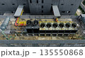 Industrial cooling system on factory rooftop. Ventilation fans. Energy efficiency, thermal management. Climate conscious energy management. Reduced emissions and sustainable energy operation. 135550868