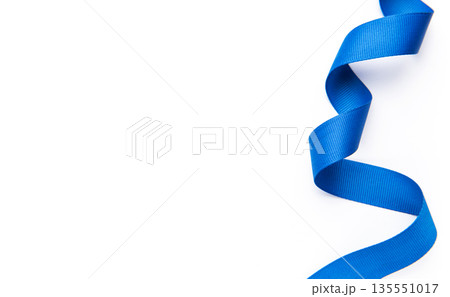 Blue ribbon curling on white background for celebtation 135551017