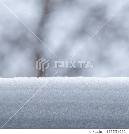 Fresh snowfall covering outdoor surface during winter season, creating a serene and peaceful natural environment 135551922