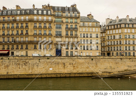 Classical Haussmann apartment buildings lining the Seine River in Paris, France Classical Haussmann apartment buildings lining the Seine River in Paris, France 135551923