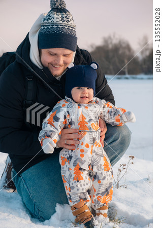 Father and Baby Enjoying Snowy Day Together Father and Baby Enjoying Snowy Day Together 135552028