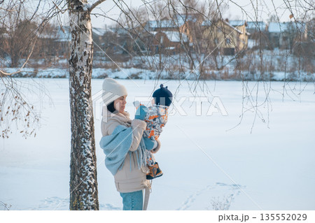 Mother and Baby in Winter Wonderland Mother and Baby in Winter Wonderland 135552029