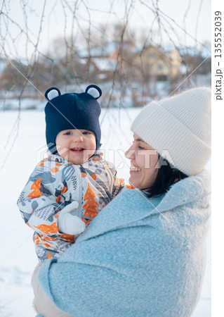 Mother and Baby Enjoying a Winter Day Mother and Baby Enjoying a Winter Day 135552039