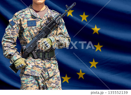 European union flag with soldier holding assault rifle European union flag with soldier holding assault rifle 135552139