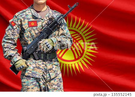Kyrgyzstan flag with soldier holding assault rifle 135552145