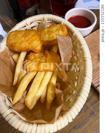 Chicken nuggets and fries with tomato sauce Chicken nuggets and fries with tomato sauce 135552180