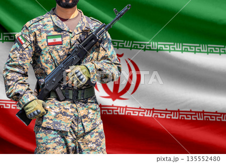 Iran flag with soldier holding assault rifle Iran flag with soldier holding assault rifle 135552480