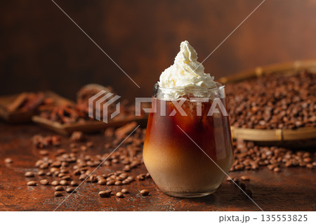 Iced coffee with whipped cream. Iced coffee with whipped cream. 135553825
