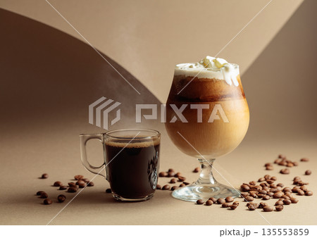 Black coffee and iced coffee cocktail on a beige background. 135553859