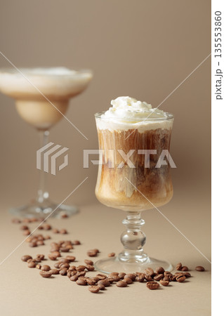 Cream and coffee cocktail on beige background. 135553860