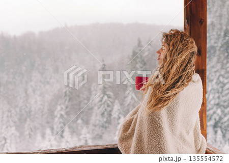 Blonde Woman in Cozy Plaid with Hot Drink 135554572