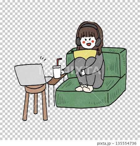 Girl sitting on sofa watching movie with headphones 135554736