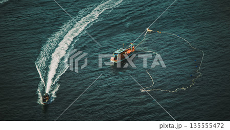 Fishing boat, rope net, aerial shot, traditional vessel Fishing boat, rope net, aerial shot, traditional vessel 135555472