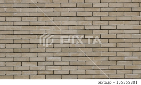 Beige brick wall with neat rows of rectangular blocks in different shades of brown and gray as an empty textured street building design background Beige brick wall with neat rows of rectangular blocks in different shades of brown and gray as an empty textured street building design background 135555881