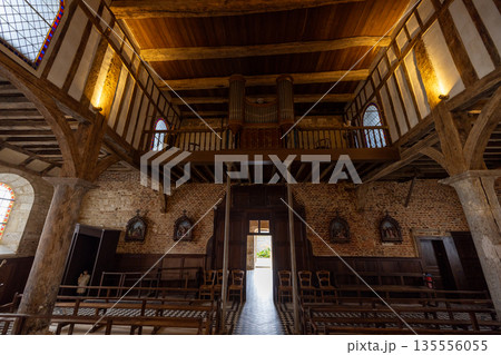 Rustic timber chapel interior with exposed beams and balconyParfondeval, Vervins, Aisne, Hauts-de 135556055