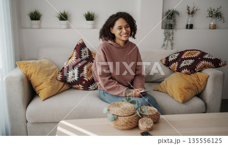 Serene Lady Enjoying Peaceful Pause, Peaceful Woman Seated On Couch Embracing Calm Reflection Moment 135556125