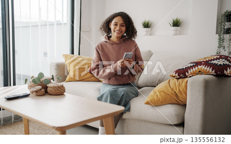 Morning Leisure Activity, Woman Relaxes On Couch Enjoying Calm Morning With Sunlight And Greenery 135556132