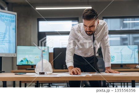 Man is working in the wind turbine company 135556356