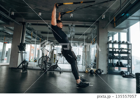 Flexibility and strength. Man is in the modern gym 135557057