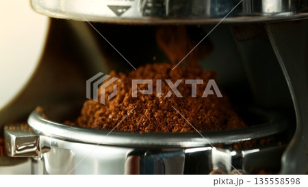 Close-up Slow Motion of Grounding Coffee from Coffee Machine Close-up Slow Motion of Grounding Coffee from Coffee Machine 135558598
